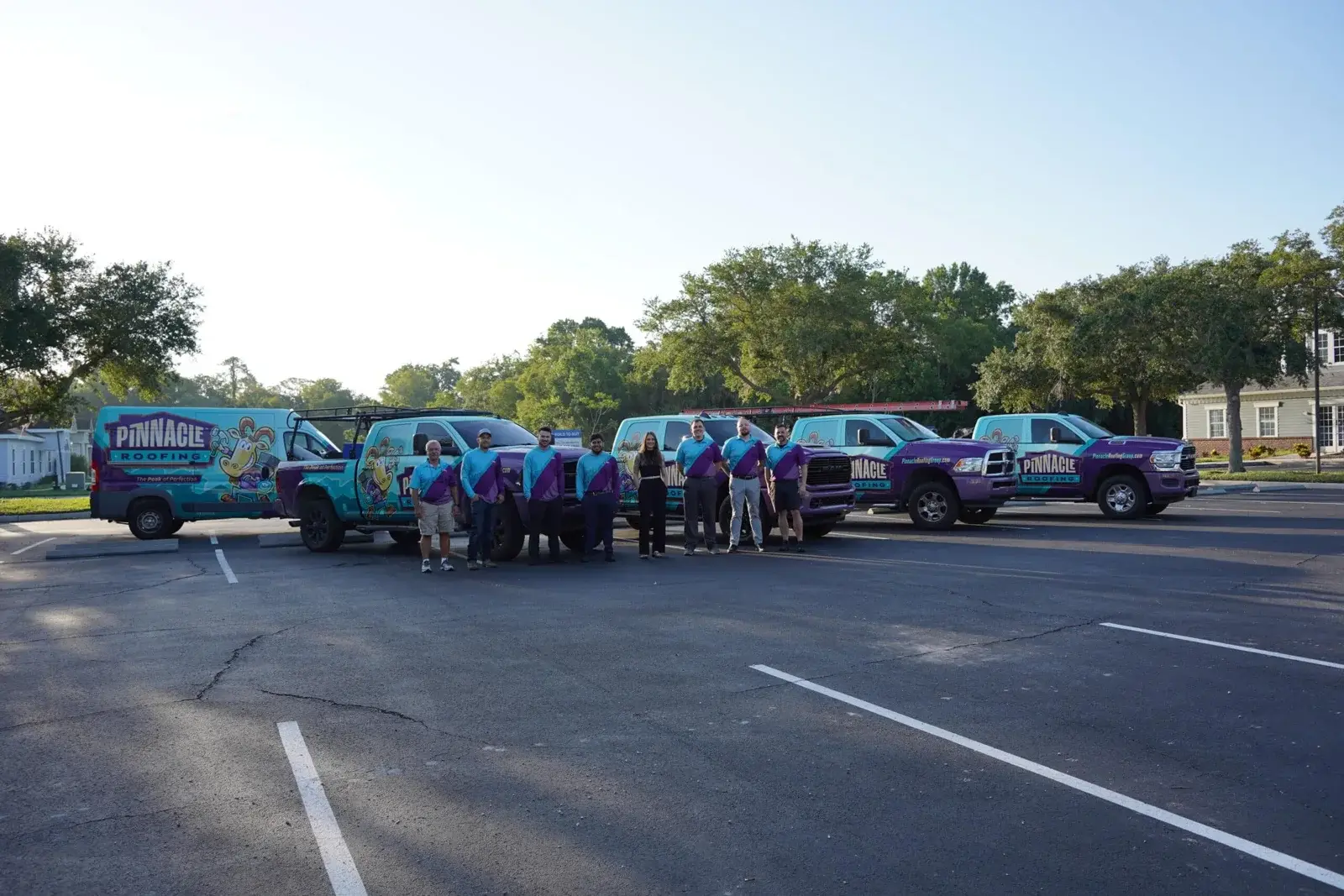 Pinnacle Roofing Group team with branded service vehicles